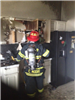 Firefighter in a Burnt Out Kitchen