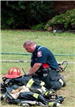 Firefighter Looking at Equipment