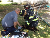 Firefighters Helping a Cat