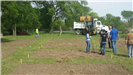 Workers and Equipment Working on the Community Garden