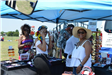 Women Shopping at Vendor Tents