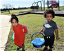 Two Kids Holding Easter Baskets
