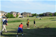 Police Officer Playing Football with Kids