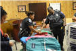 Police Officers Sorting Backpacks