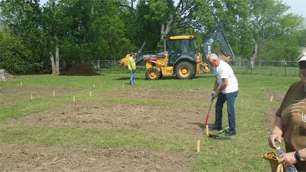 Man Clearing a Garden Plot