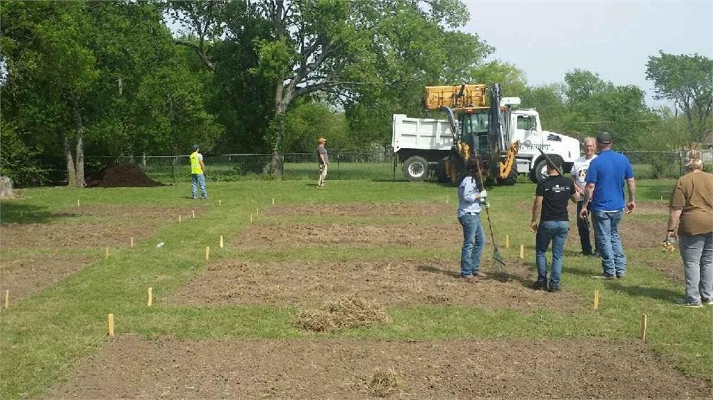 Workers and Equipment Working on the Community Garden