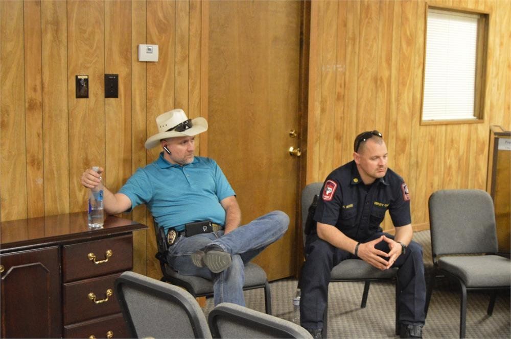 Two Officers Sitting Together