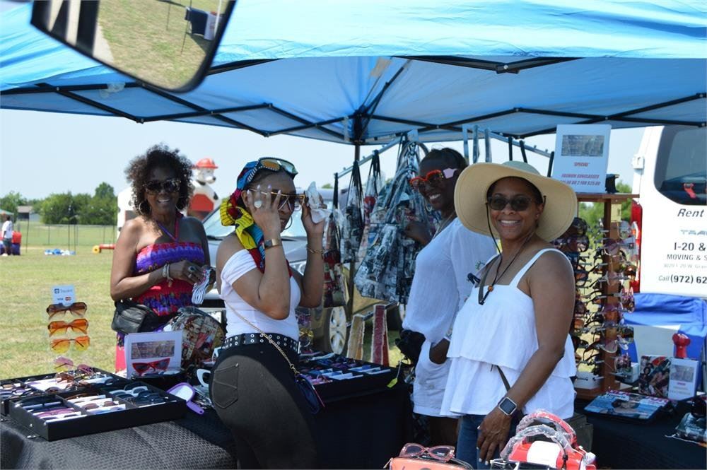 Women Shopping at Vendor Tents