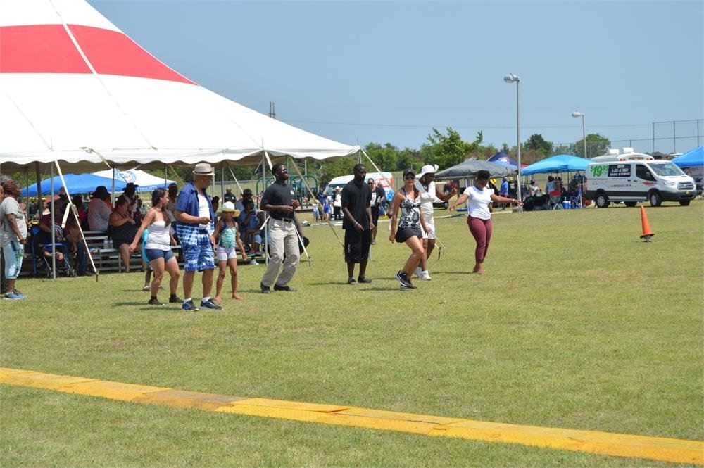 People Dancing on a Lawn