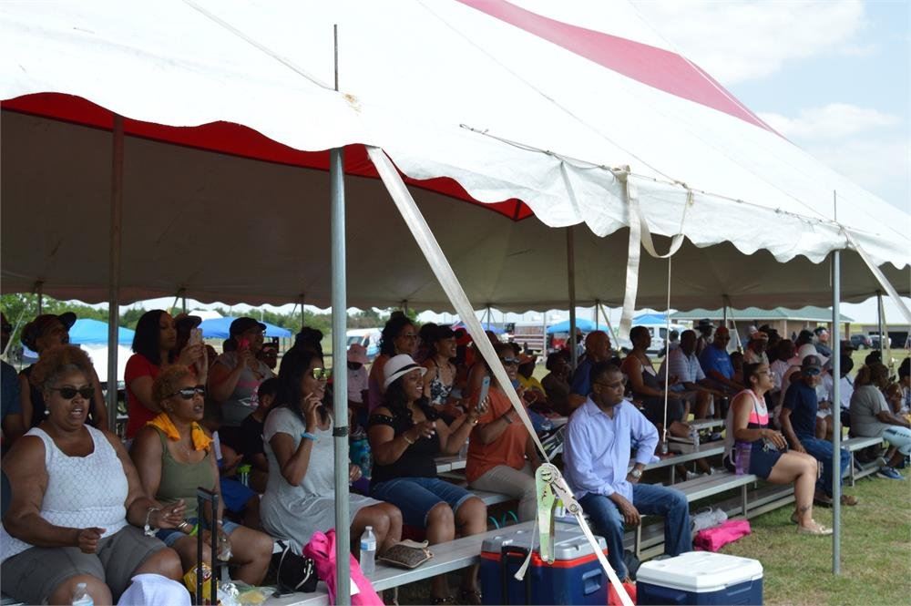 People Sitting in Bleachers