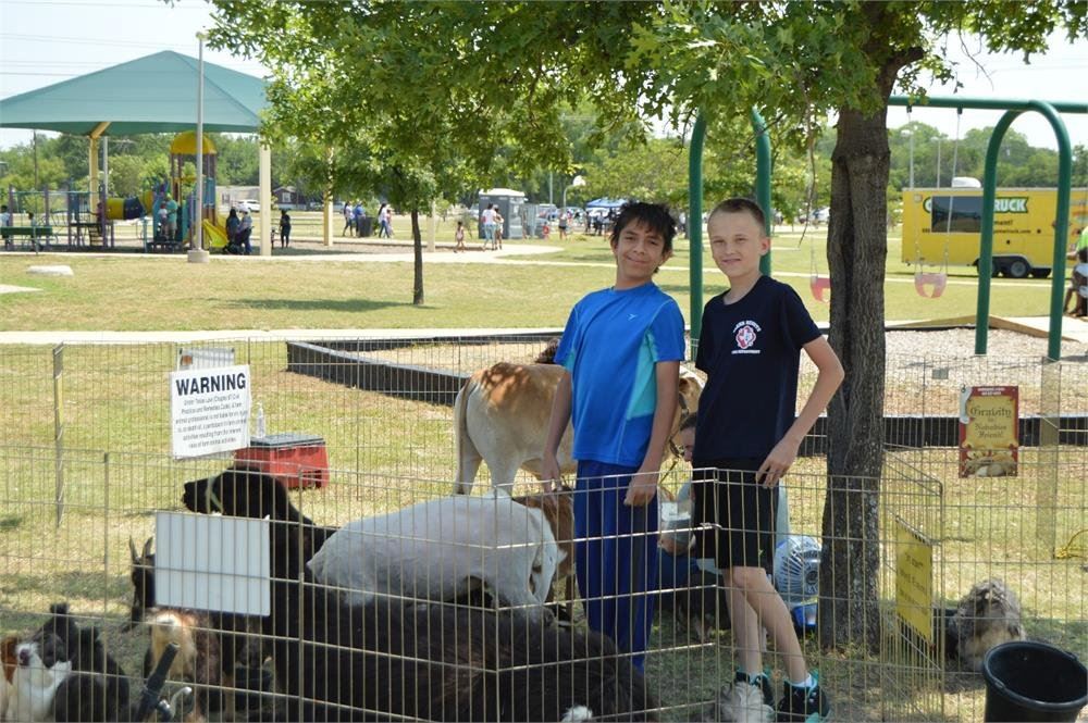 Two Kids at a Petting Zoo