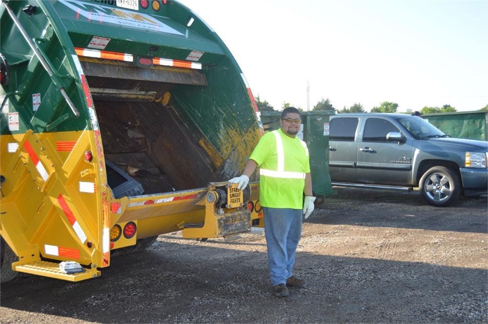 Volunteer Standing by Trash Truck