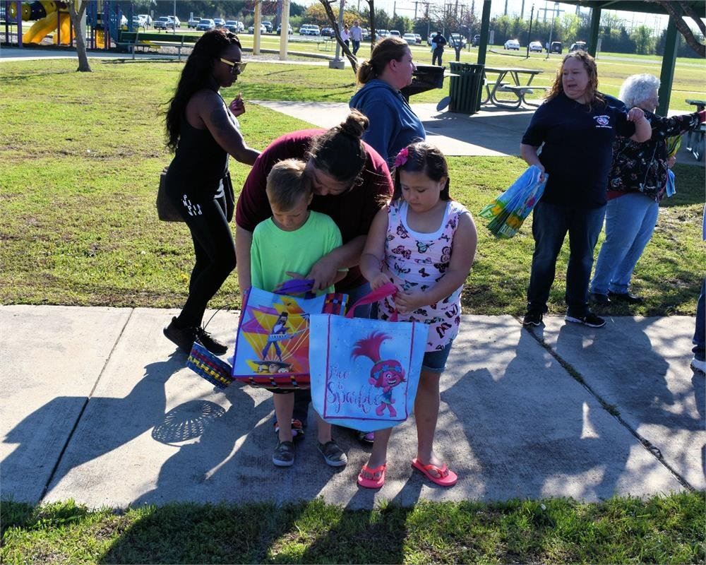 Mom Helping Kids Get Ready to Hunt Eggs