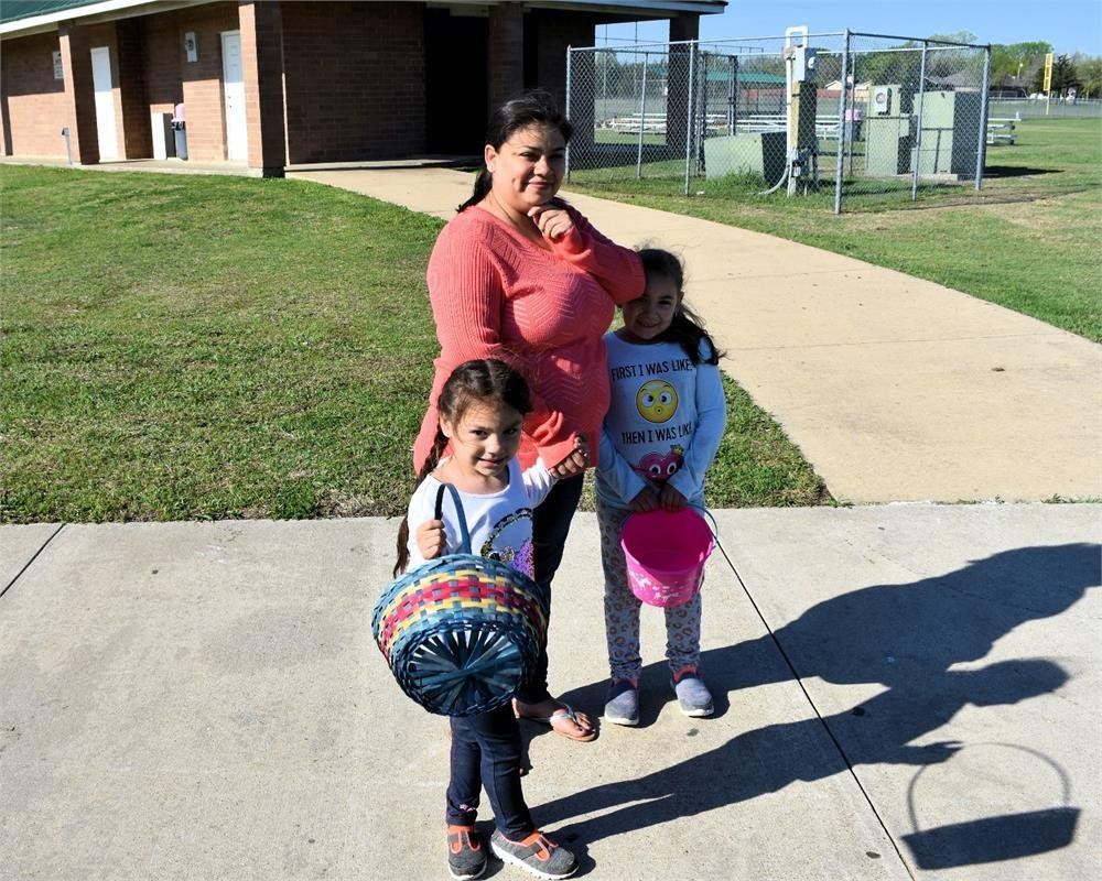 Mother and Two Daughters with Easter Baskets