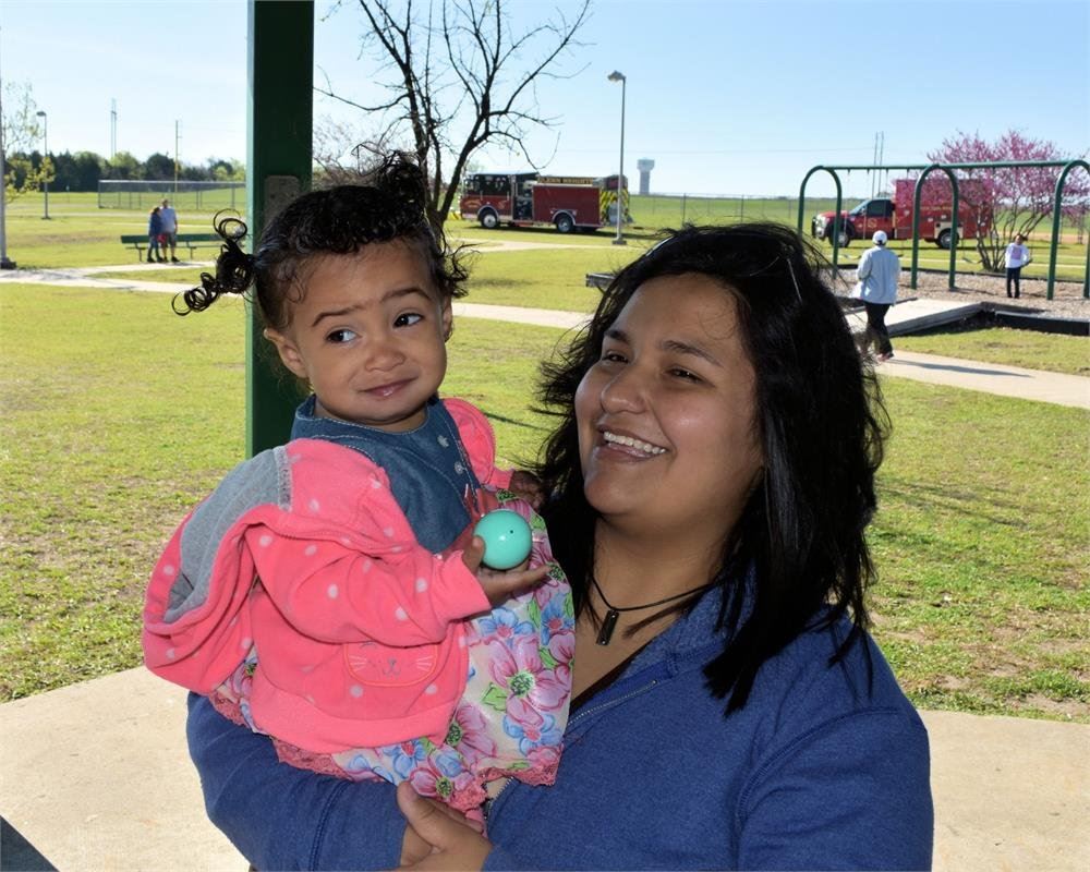 Mother Holding Small Daughter