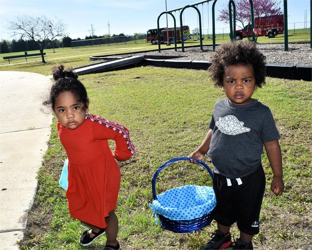 Two Kids Holding Easter Baskets