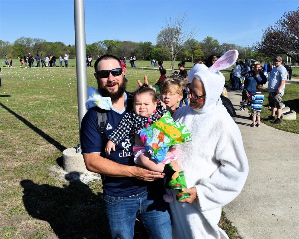 Women in Easter Bunny Costume with a Family