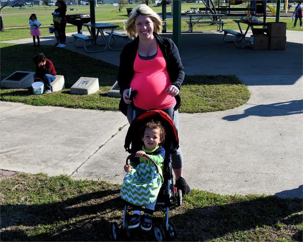 Women Pushing Child in a Stroller
