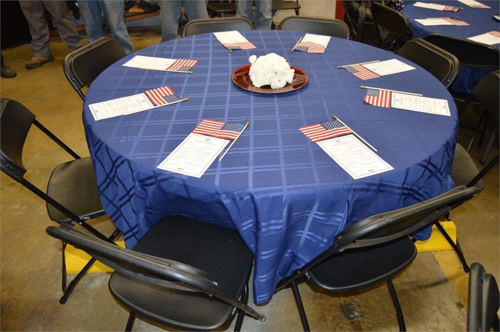 Table Decorated with American Flags and Blue Table Cloth