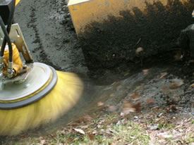 Brush Machine Scrubs the Street Clear of Dust and Leaves